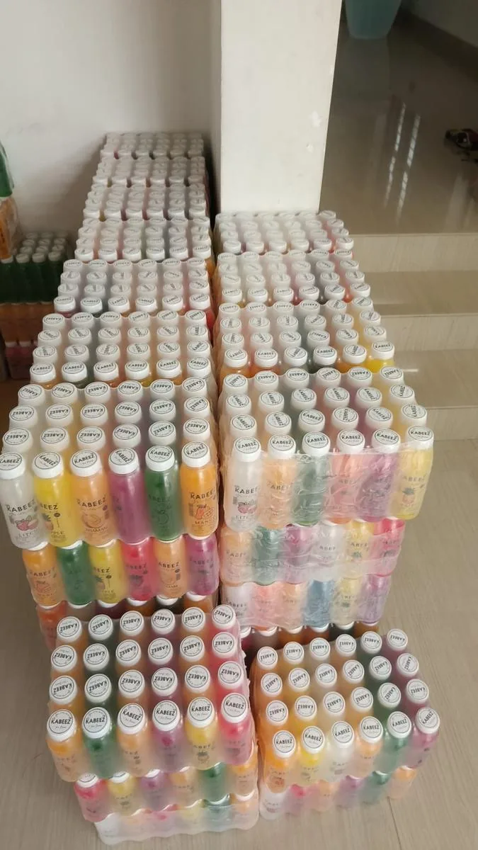 Cases of drinks and ice cream stacked and ready at the Advaitha stockroom, Attingal
